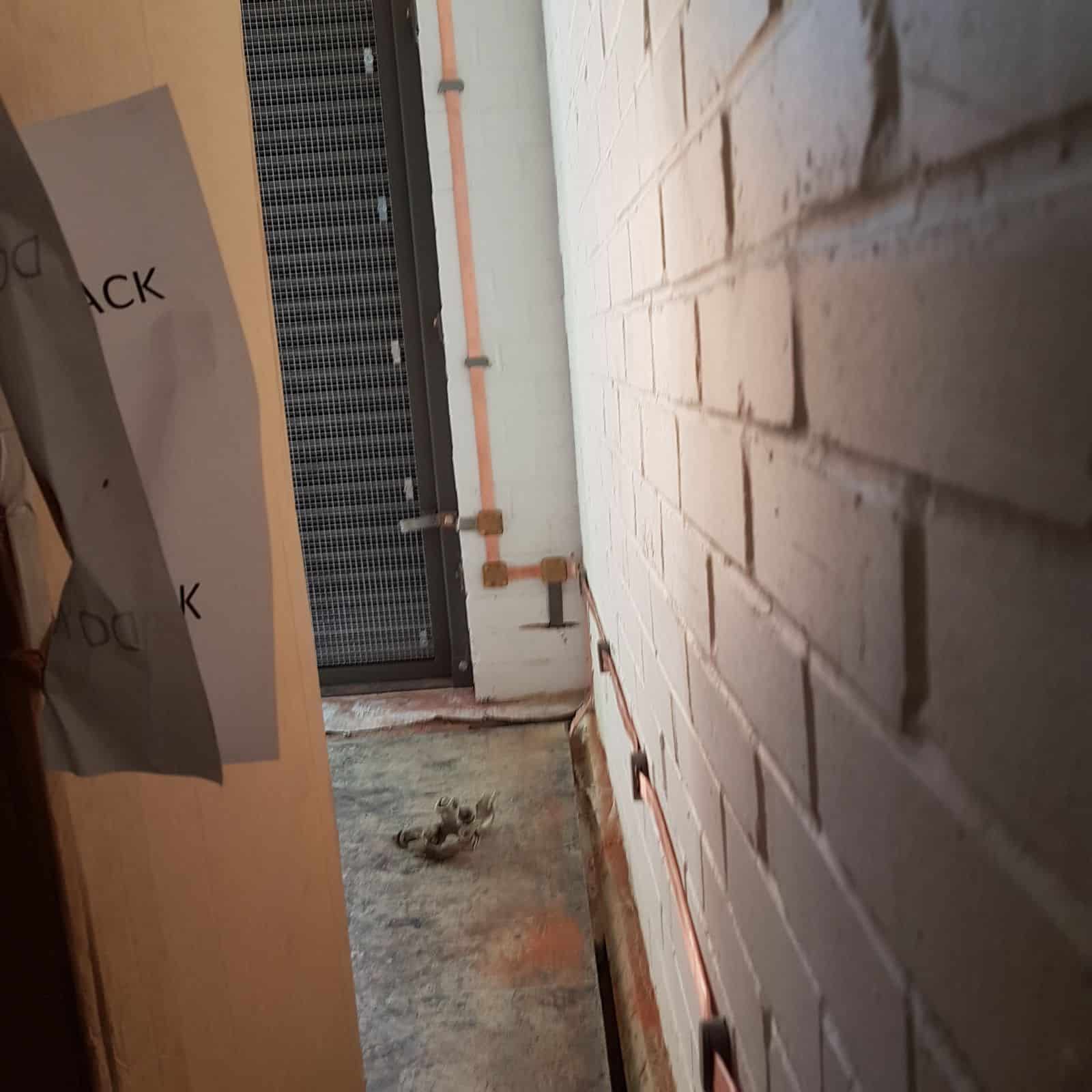 Earthing System Attached to Brick Wall